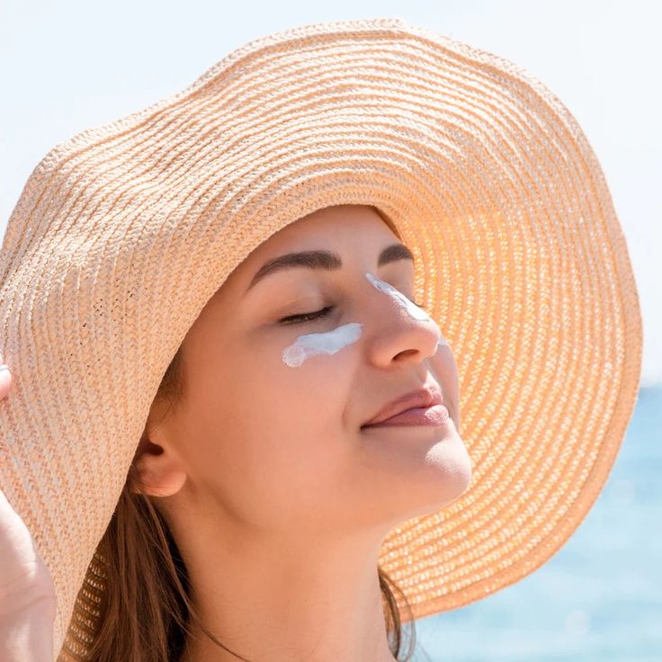  bottle of Bentica broad-spectrum sunscreen placed on a sunlit beach with SPF protection details.